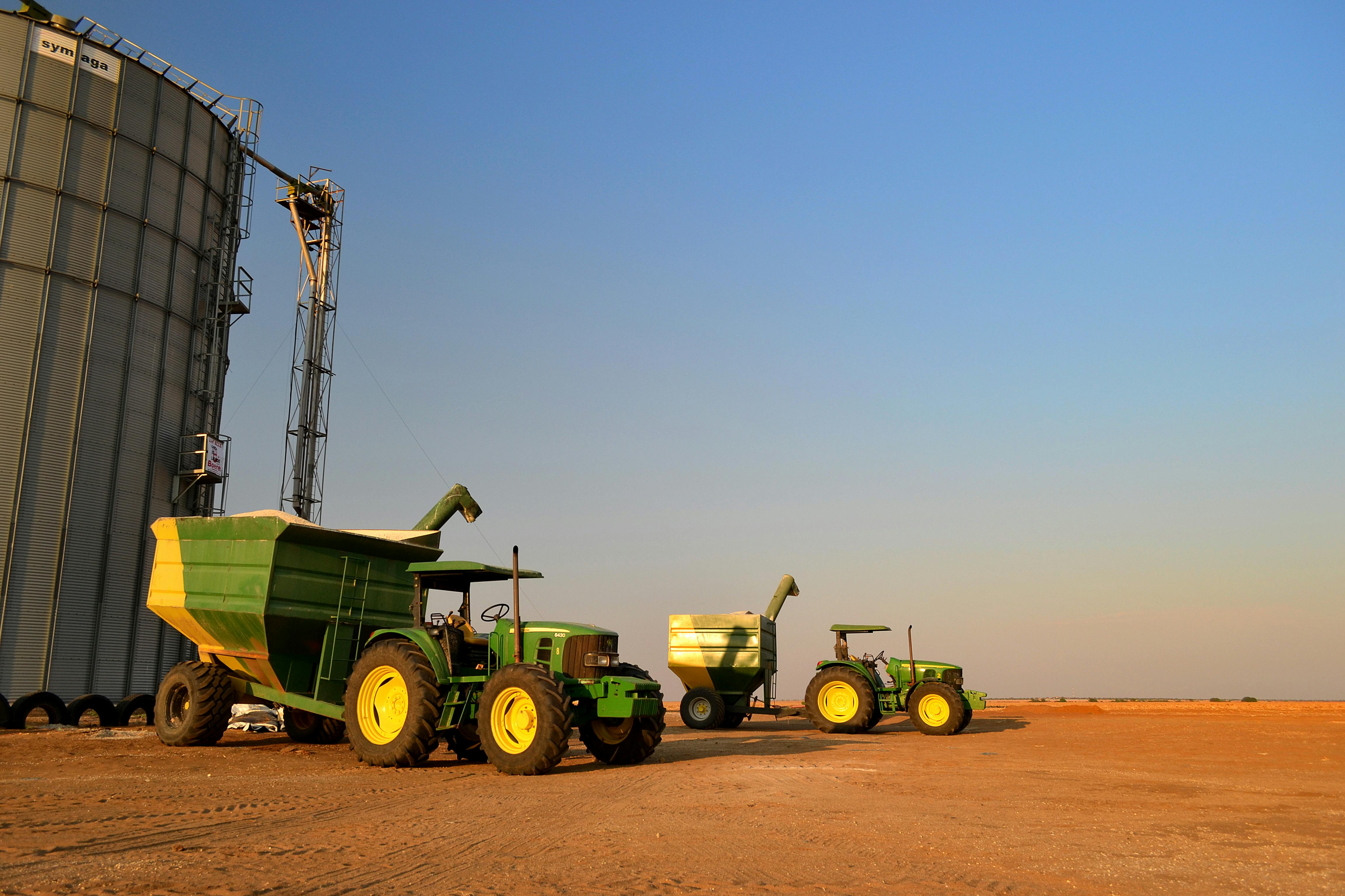 Tractors and grain silos at agricultural depot